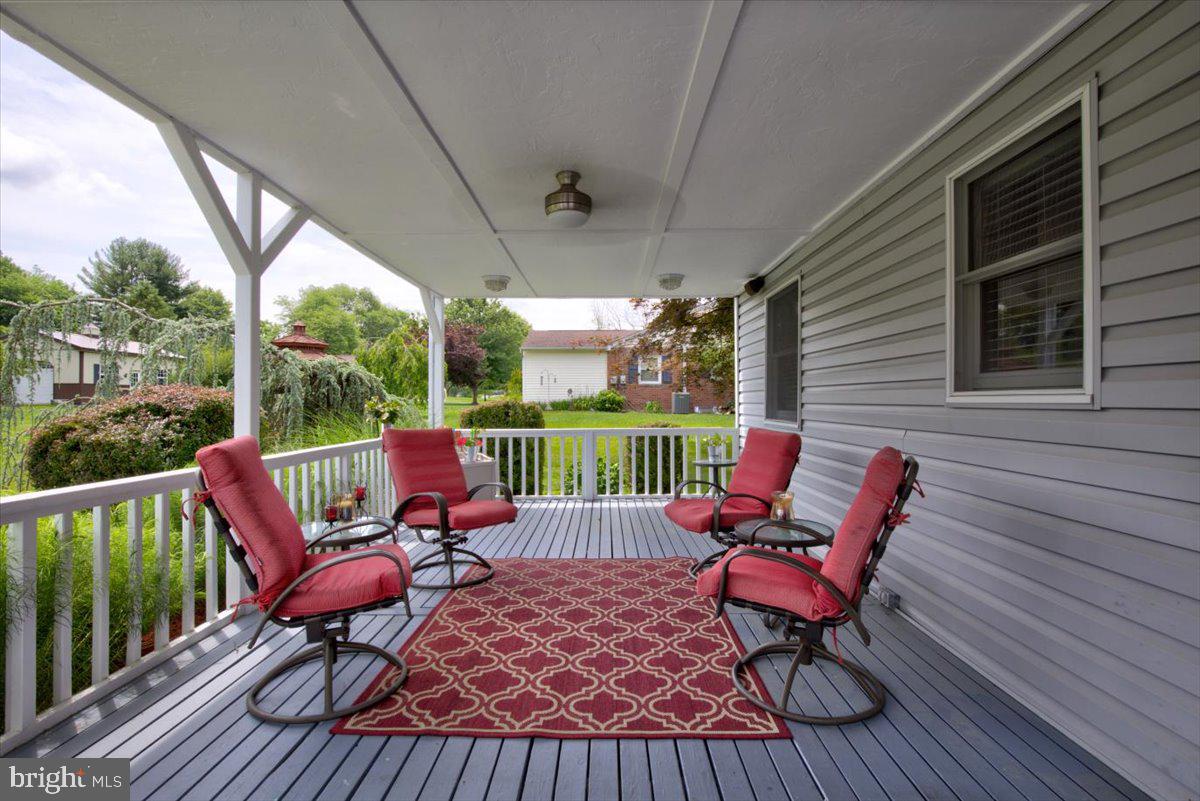 1220 South Rapps Dam Road Phoenixville, PA 19460 - Photo 9 of 44 Covered deck with fan and lighting.