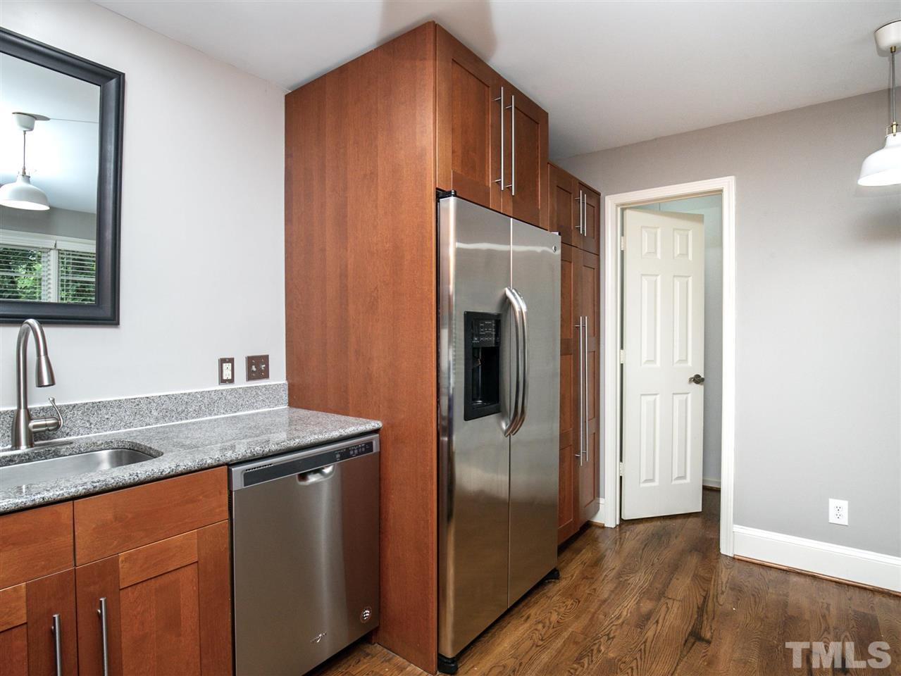 2542 Noble Road Raleigh, NC 27608 - Photo 13 of 27 a kitchen with stainless steel appliances granite countertop a refrigerator and a sink