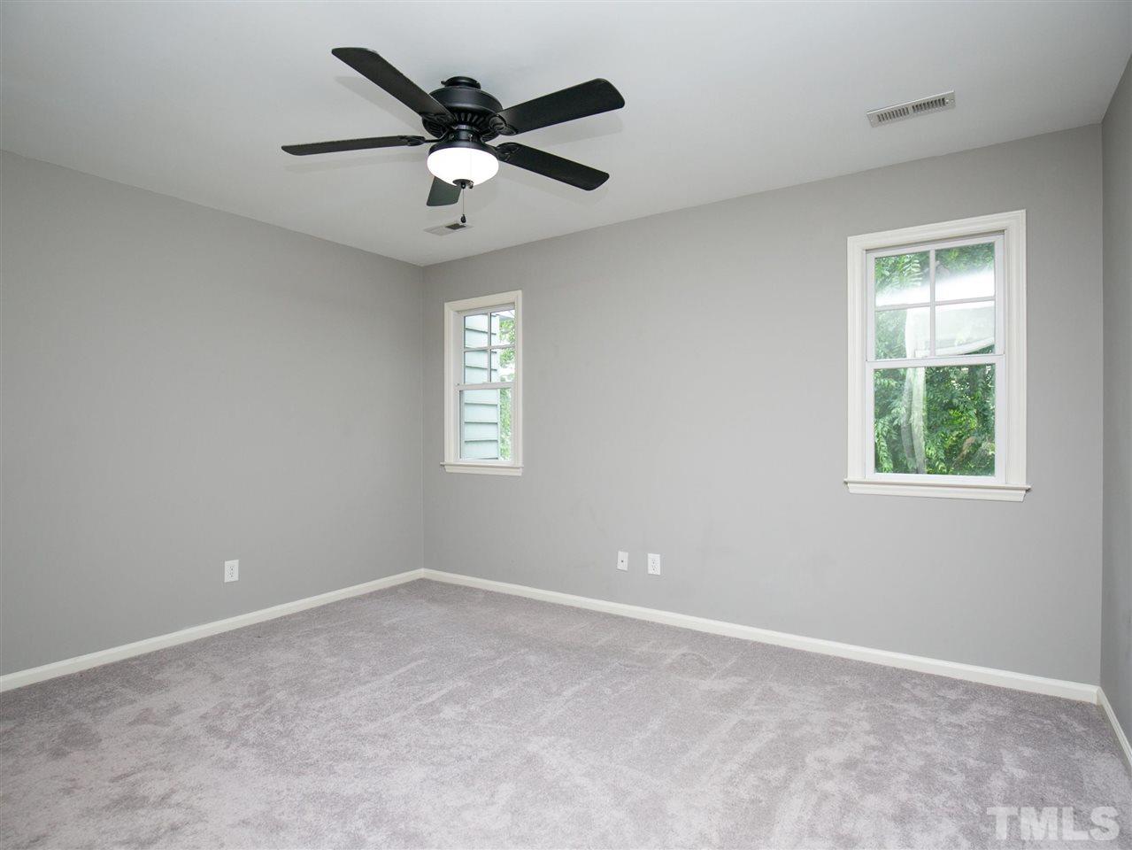 2542 Noble Road Raleigh, NC 27608 - Photo 15 of 27 an empty room with a window and a fan