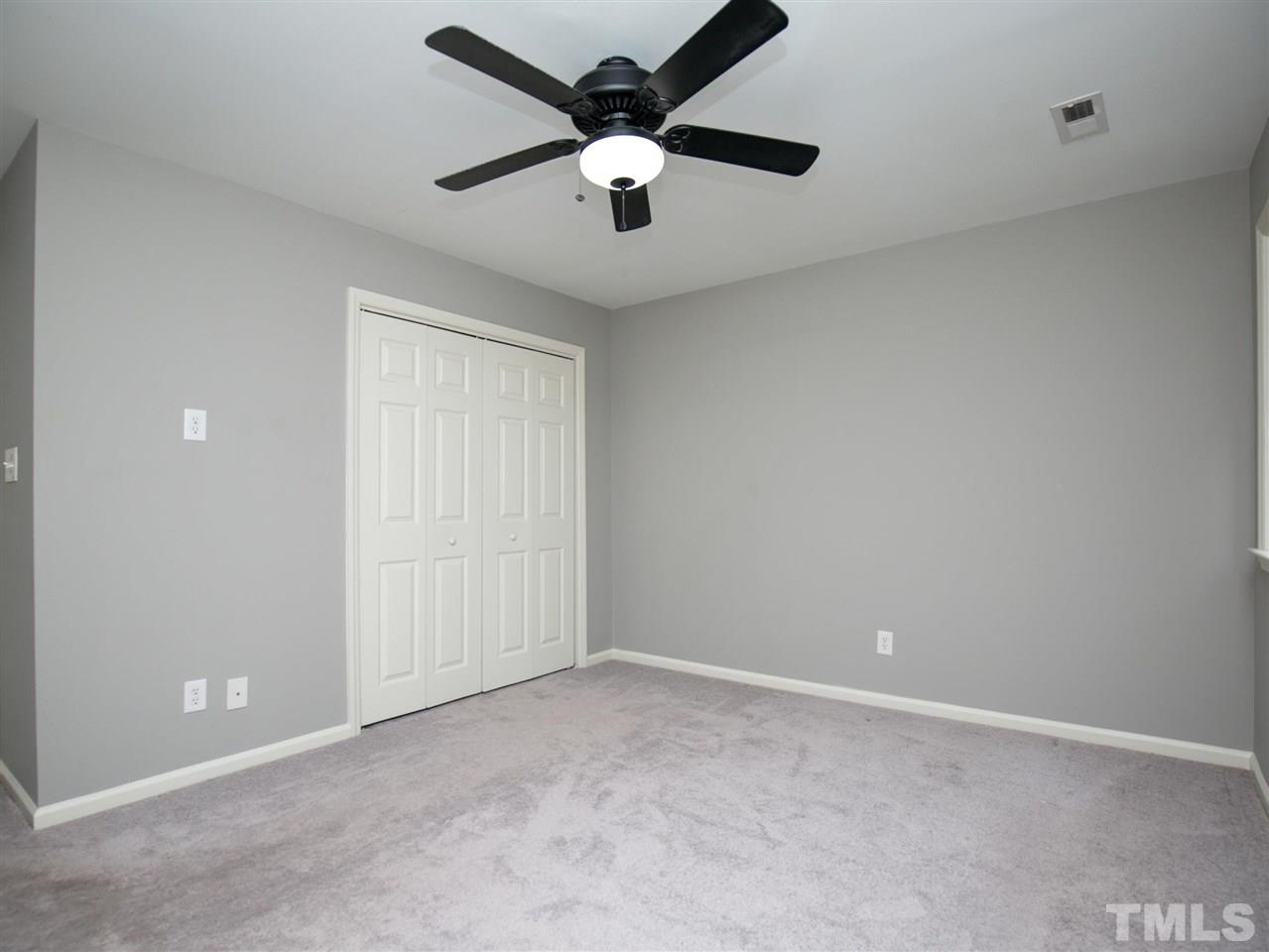 2542 Noble Road Raleigh, NC 27608 - Photo 16 of 27 an empty room with a ceiling fan and a window