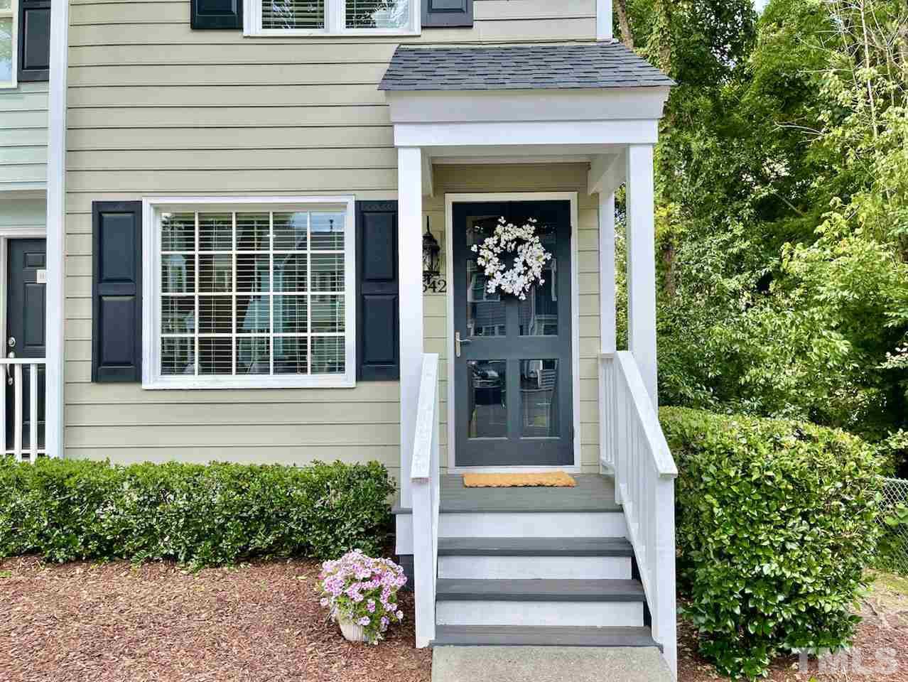 2542 Noble Road Raleigh, NC 27608 - Photo 3 of 27 a front view of a house with potted plants