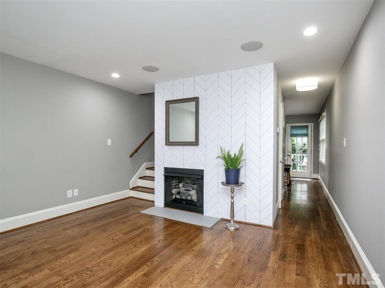 2542 Noble Road Raleigh, NC 27608 - Photo 4 of 27 a view of a livingroom with a fireplace