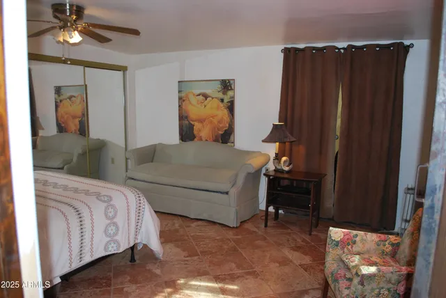 a bench sitting in a room next to a window