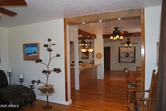a living room with furniture and chandelier