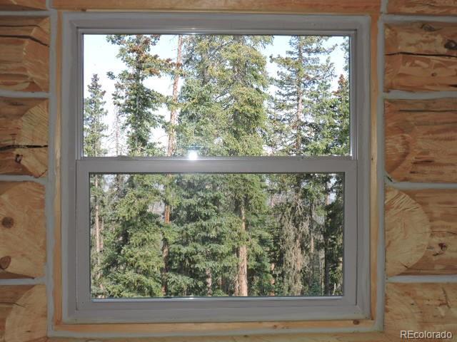 6548 Giesse Road San Luis, CO 81152 - Photo 27 of 45 a view of a room with a large window and wooden floor