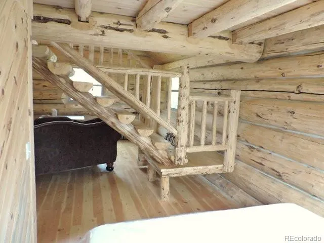 a living room with lots of furniture and a chandelier