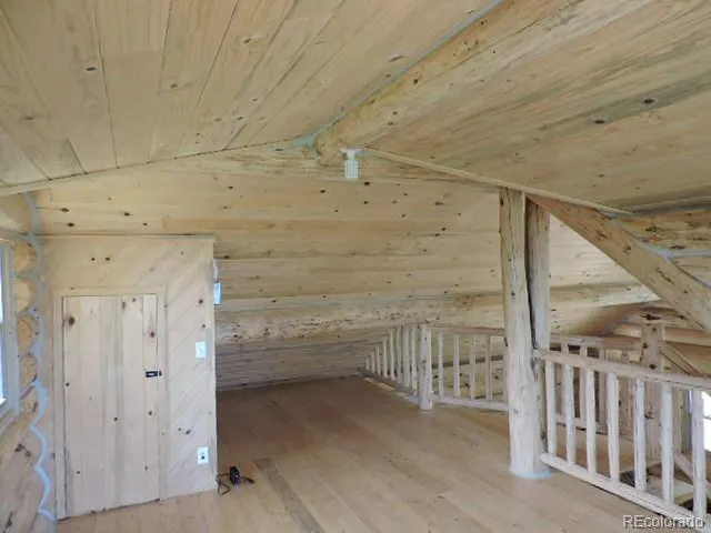 a bathroom with a shower and a glass door