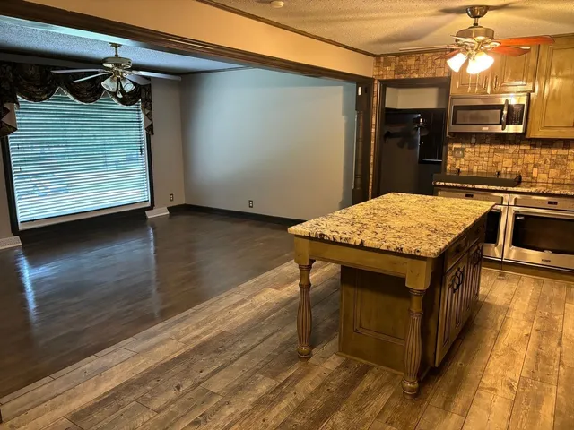 a kitchen with a table and chairs