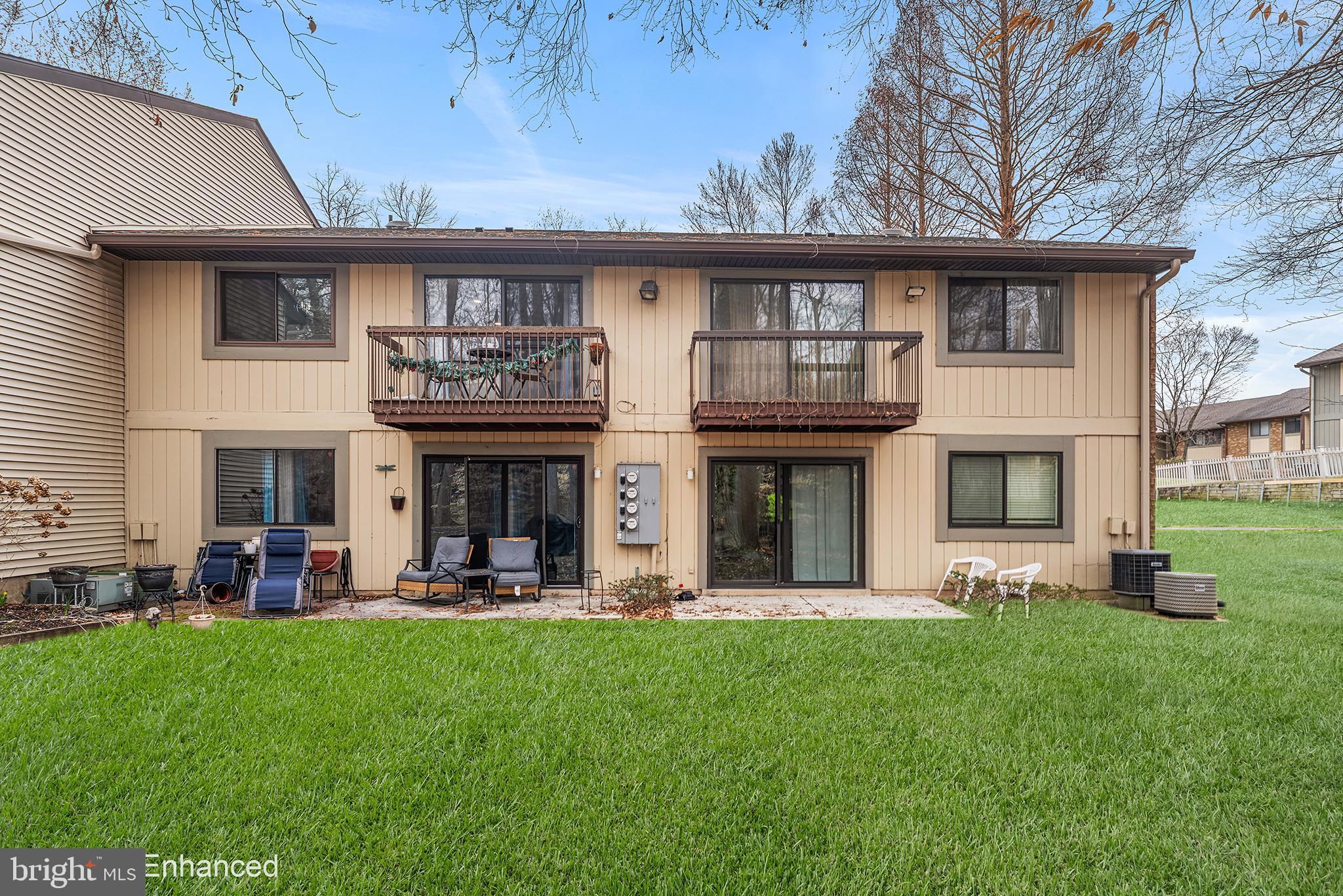 115 East Kings Highway, Unit 186 Maple Shade, NJ 08052 - Photo 22 of 25 a front view of a house with a garden and plants
