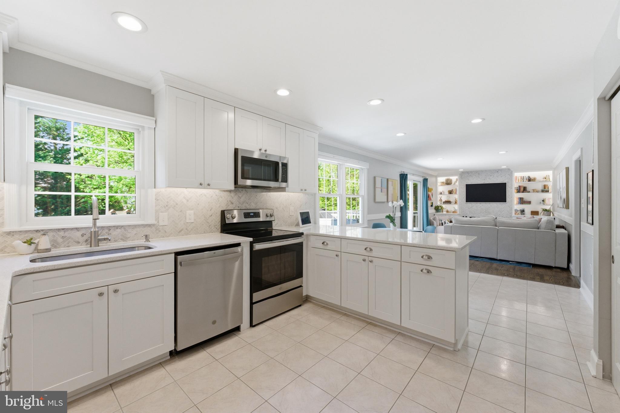 6445 Linway Terrace McLean, VA 22101 - Photo 12 of 46 a kitchen with sink and white cabinets