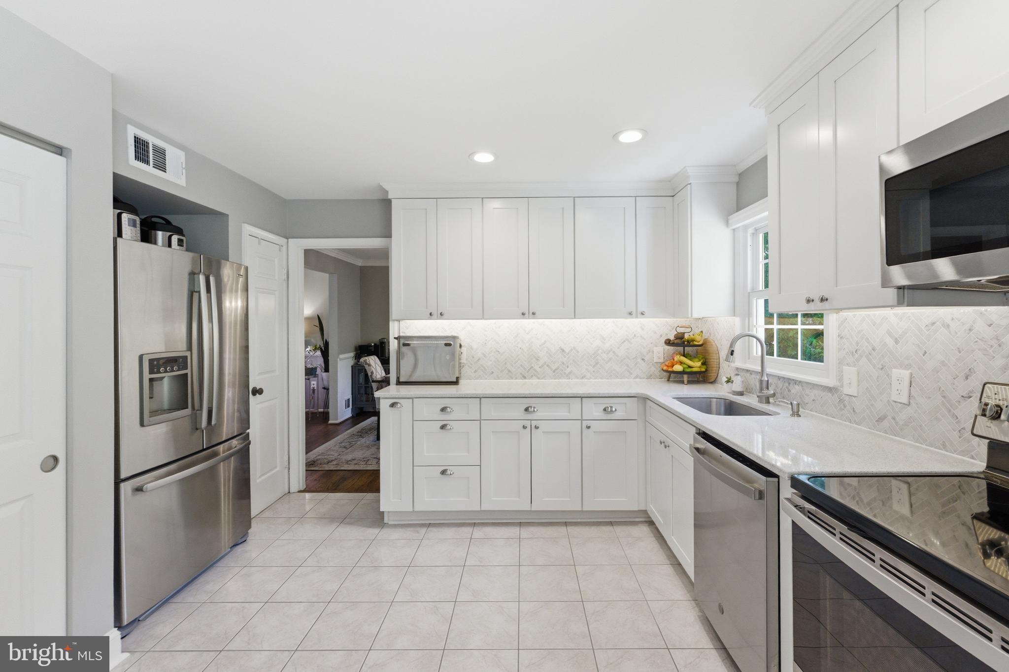 6445 Linway Terrace McLean, VA 22101 - Photo 15 of 46 a kitchen with a sink appliances and cabinets