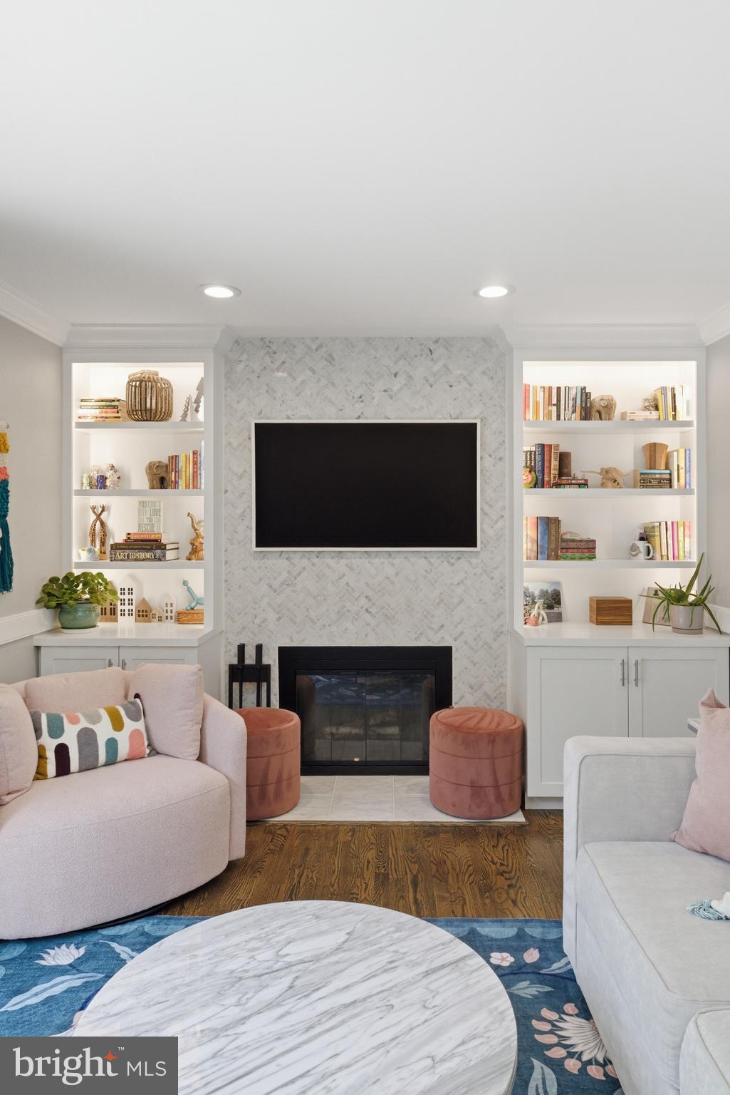 6445 Linway Terrace McLean, VA 22101 - Photo 21 of 46 a living room with furniture flat screen tv and a fireplace