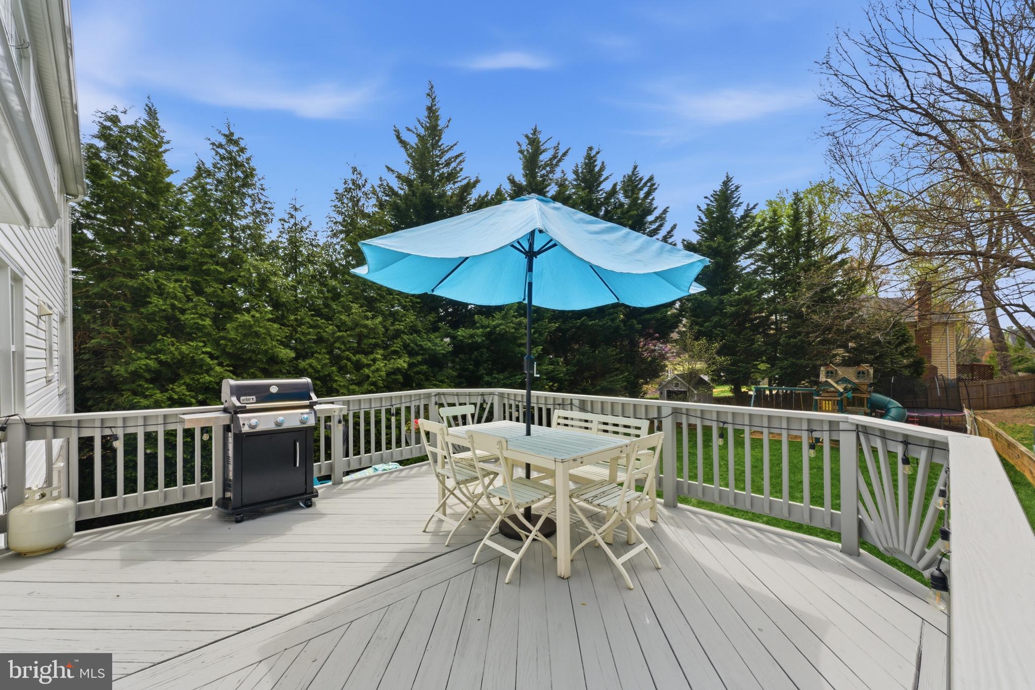 6445 Linway Terrace McLean, VA 22101 - Photo 23 of 46 a view of balcony with furniture and umbrella