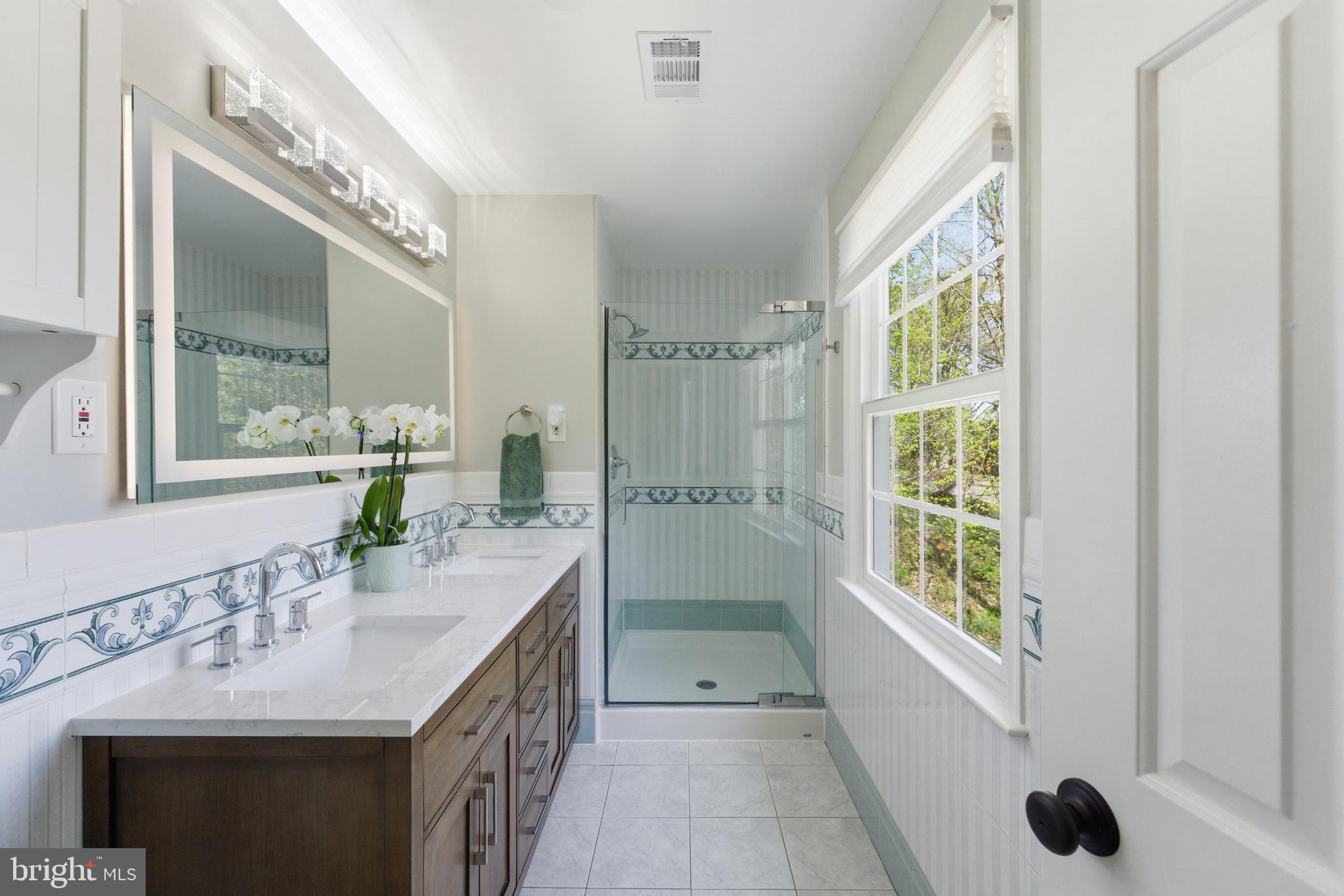 6445 Linway Terrace McLean, VA 22101 - Photo 27 of 46 a bathroom with a granite countertop sink and a mirror