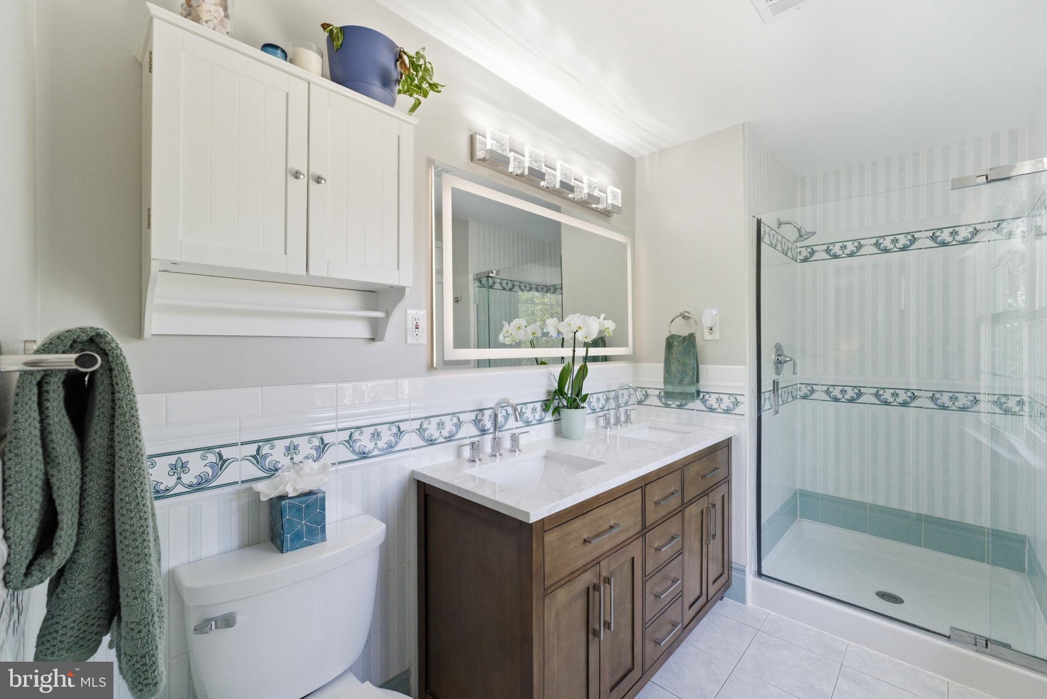 6445 Linway Terrace McLean, VA 22101 - Photo 28 of 46 a bathroom with a sink and a mirror