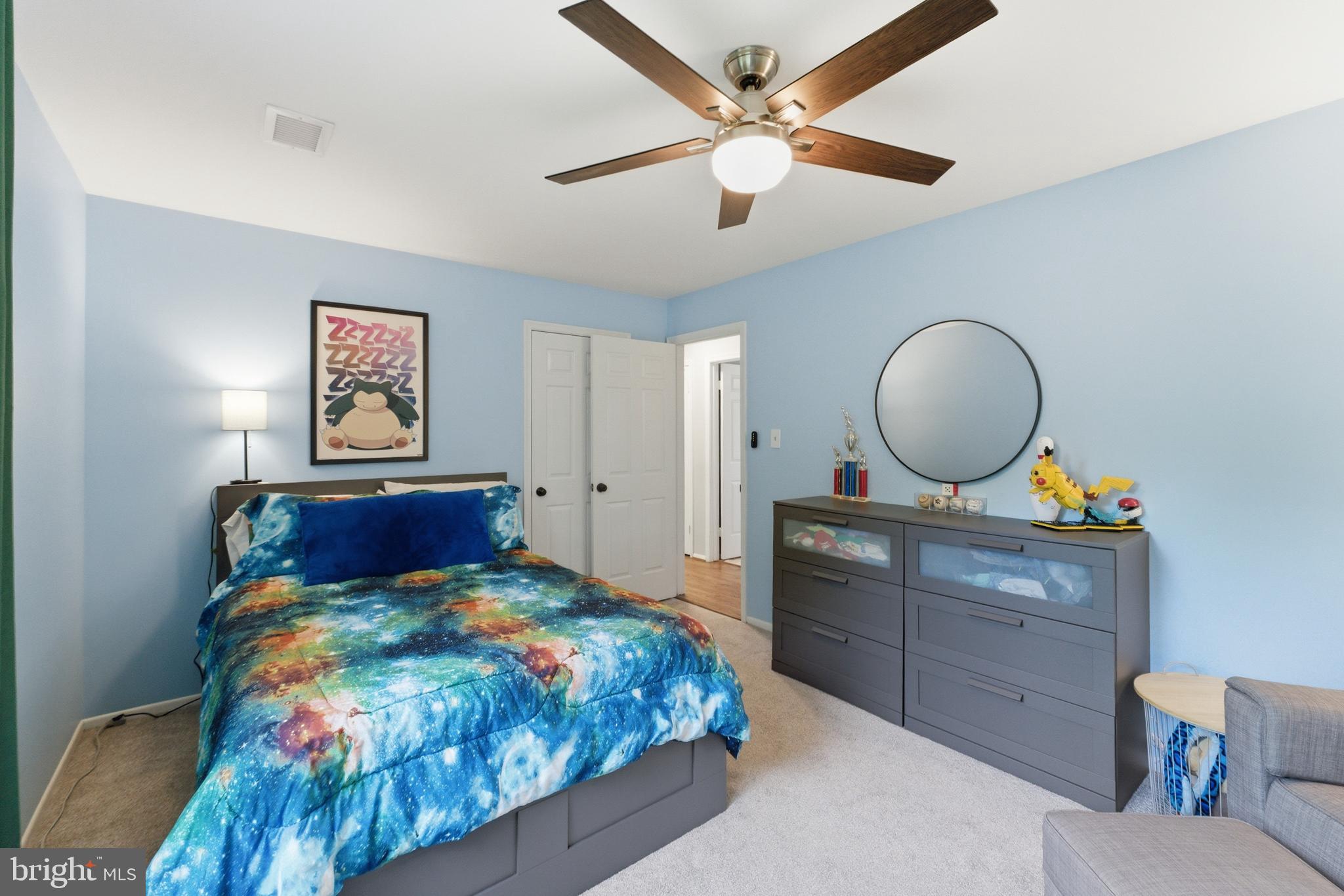 6445 Linway Terrace McLean, VA 22101 - Photo 31 of 46 a bedroom with a bed and a chandelier