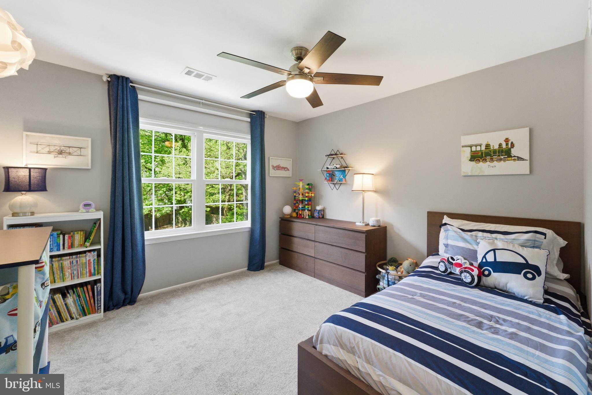 6445 Linway Terrace McLean, VA 22101 - Photo 32 of 46 a bedroom with a bed and a book shelf