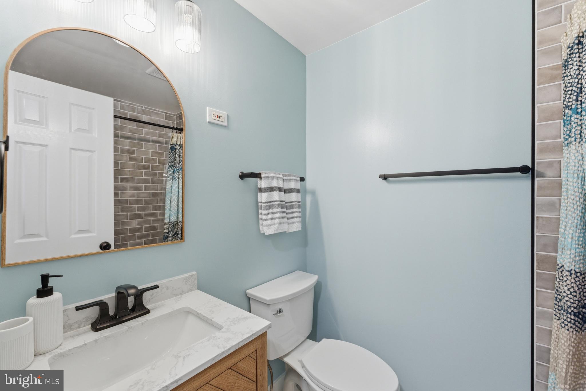 6445 Linway Terrace McLean, VA 22101 - Photo 39 of 46 a bathroom with a toilet sink and vanity