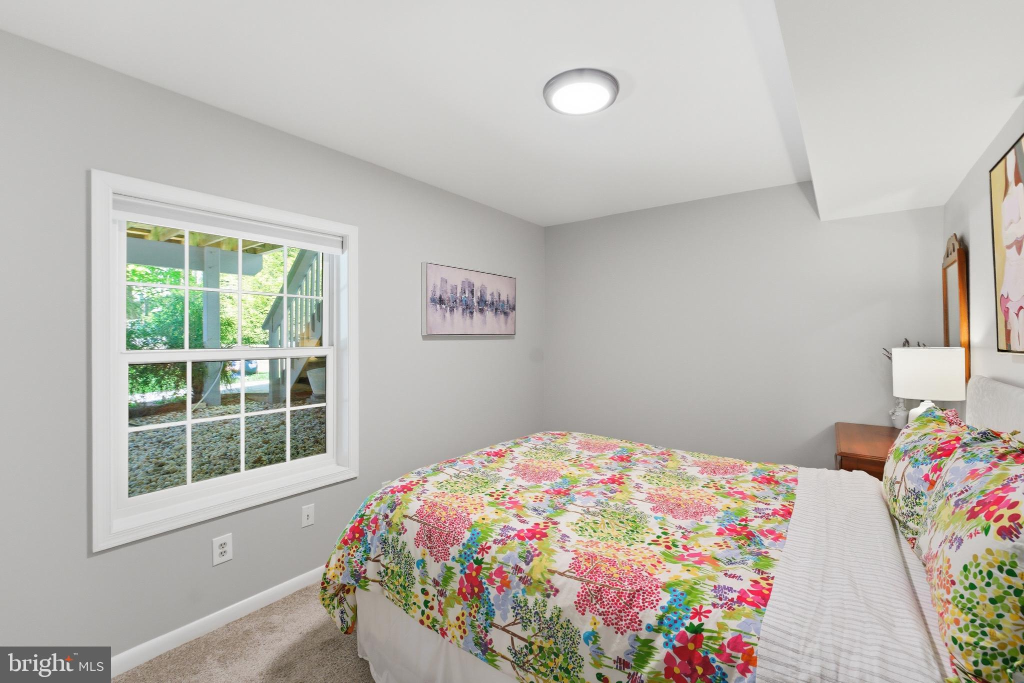 6445 Linway Terrace McLean, VA 22101 - Photo 41 of 46 a bedroom with a bed and a window