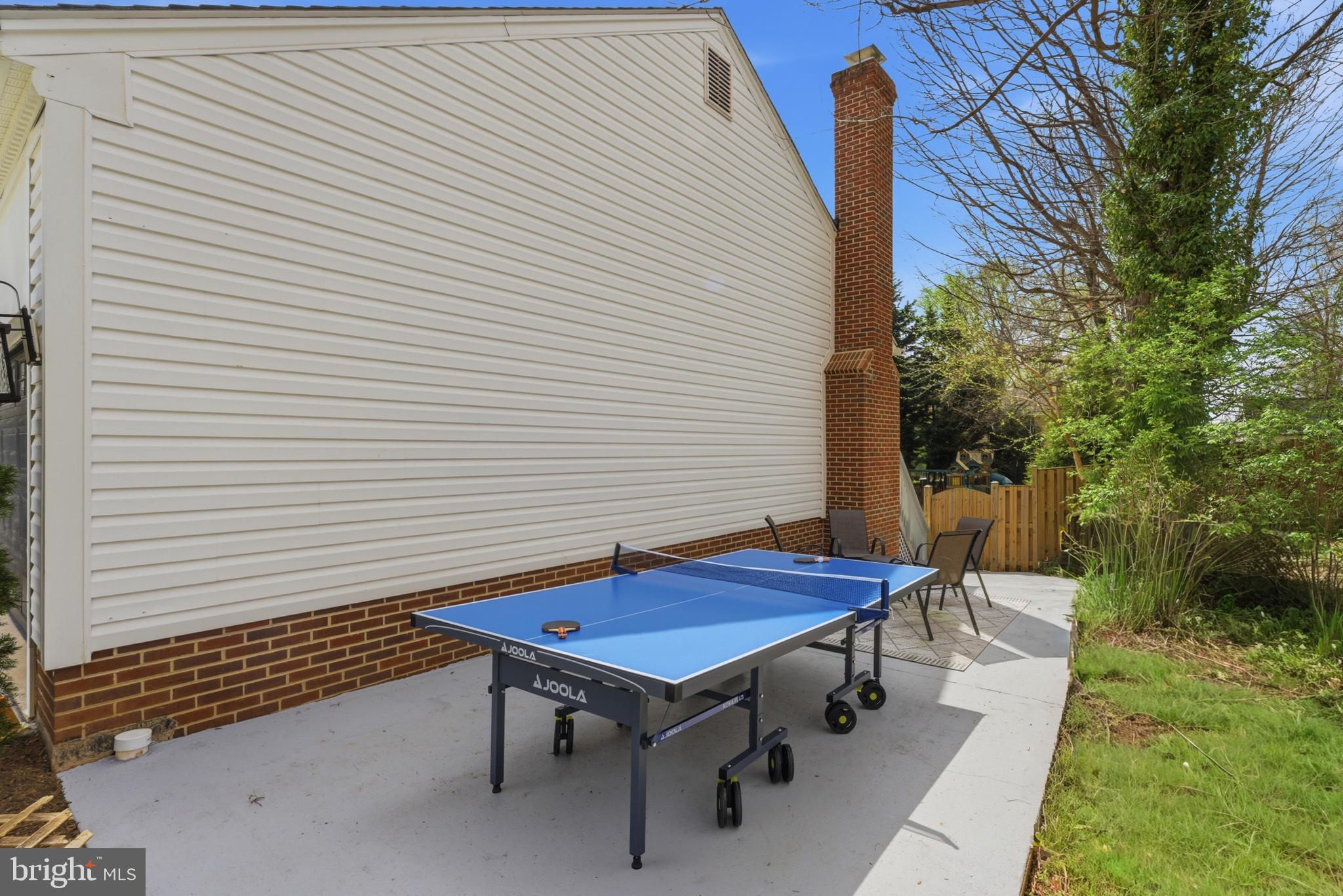 6445 Linway Terrace McLean, VA 22101 - Photo 44 of 46 a backyard of a house with table and chairs