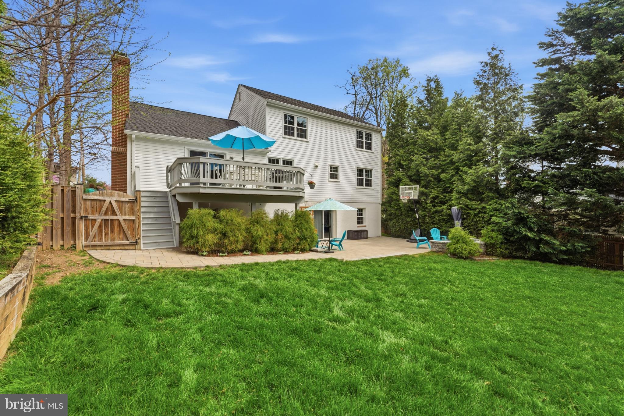 6445 Linway Terrace McLean, VA 22101 - Photo 5 of 46 a view of a house with backyard and a sitting area