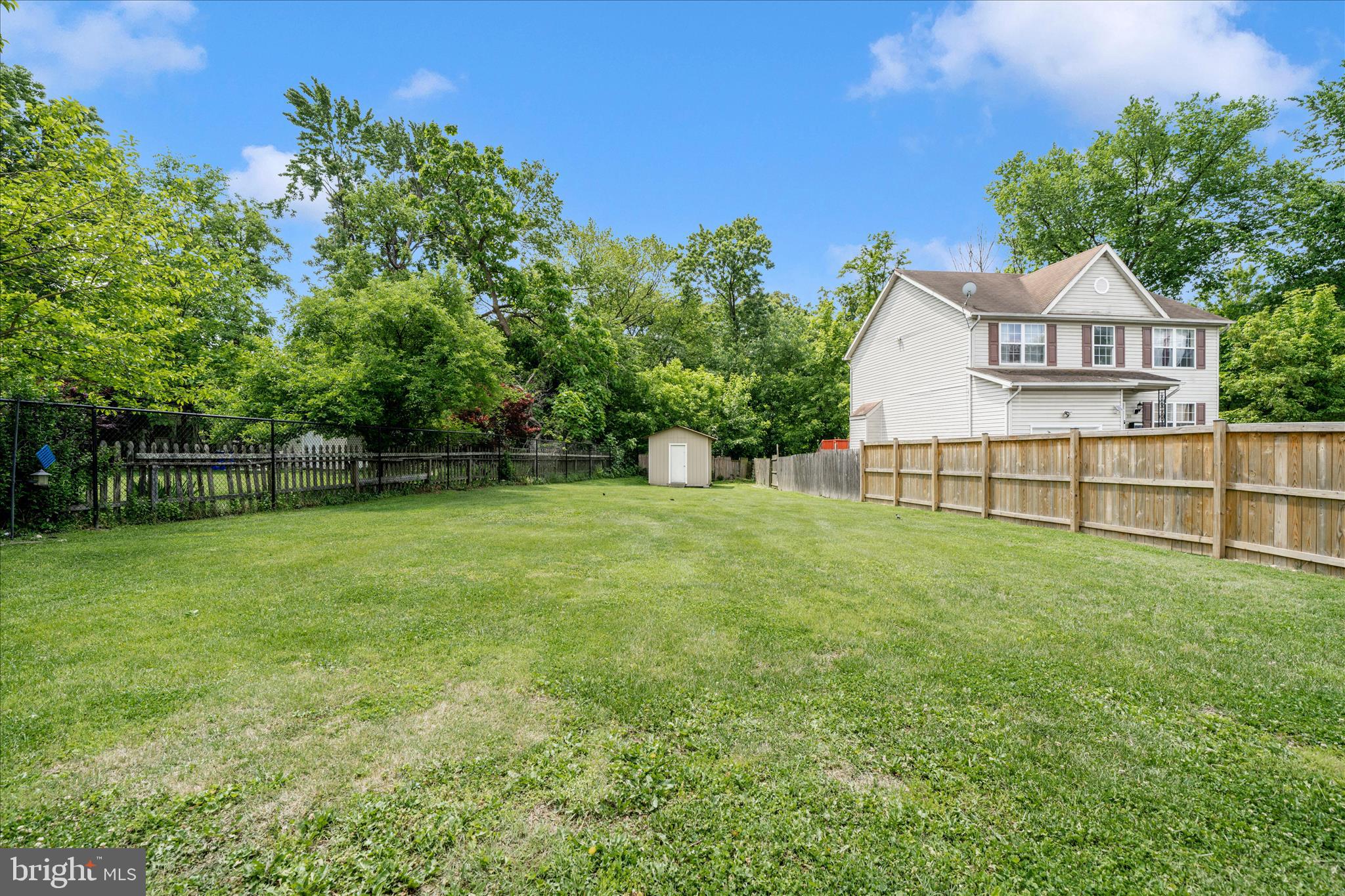 713 Seek Lane Silver Spring, MD 20912 - Photo 44 of 60 a front view of a house with a yard