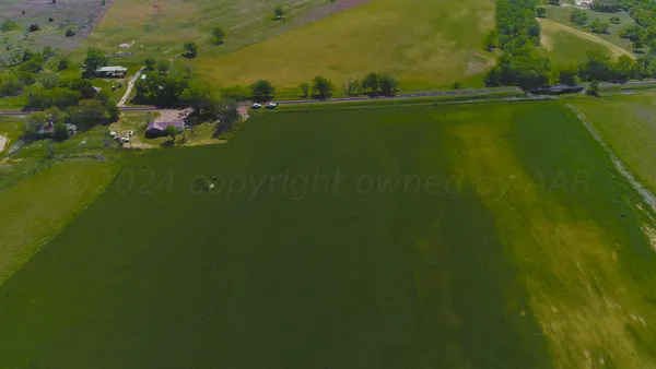 a view of a golf course with a lake