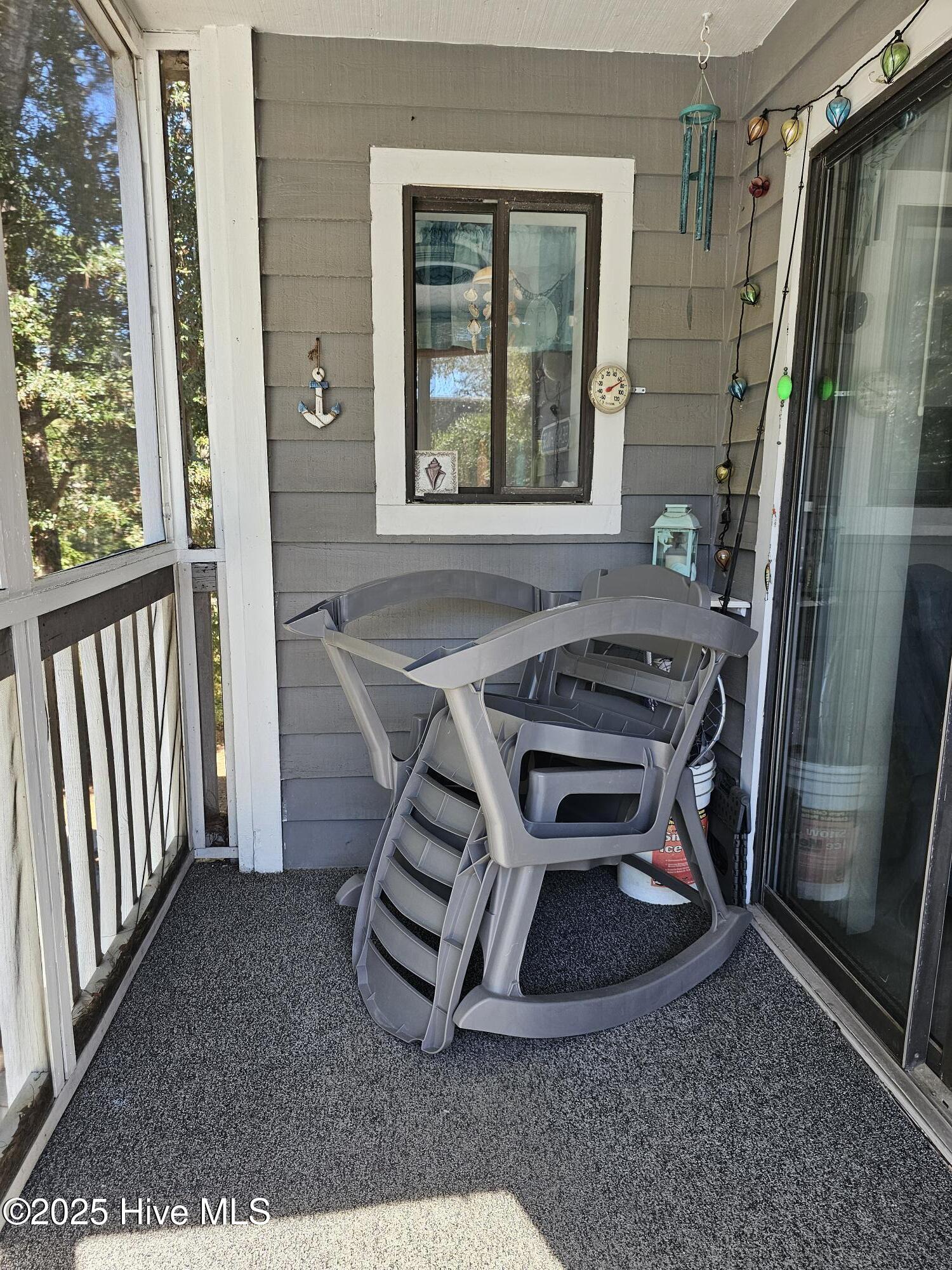 10172 Beach Drive Southwest, Unit 2206 Calabash, NC 28467 - Photo 31 of 53 Window to Dining Area from Porch