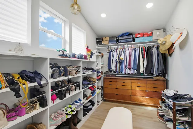 a view of a patio with table and chairs and floor to ceiling window