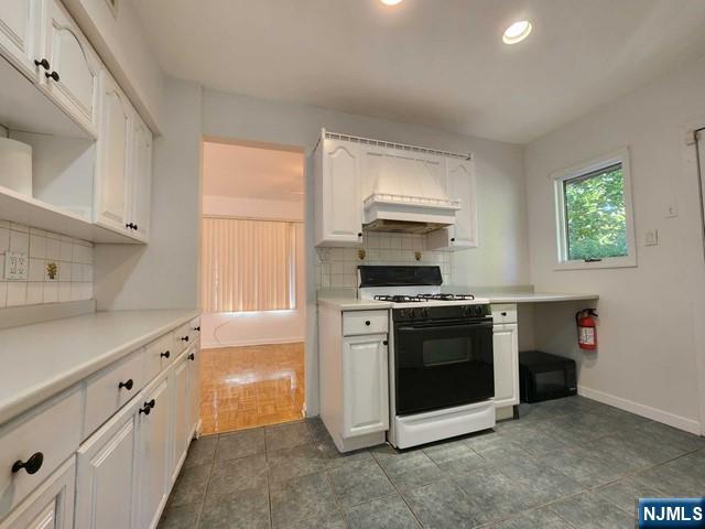 26 7th Street, Unit B Cresskill, NJ 07626 - Photo 11 of 26 a kitchen with stainless steel appliances a stove sink and microwave