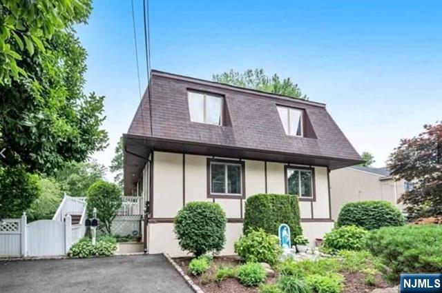 26 7th Street, Unit B Cresskill, NJ 07626 - Photo 2 of 26 a front view of a house with a yard