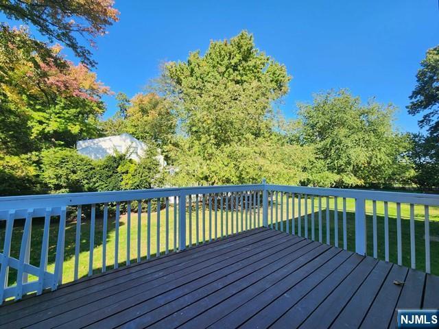 26 7th Street, Unit B Cresskill, NJ 07626 - Photo 22 of 26 a balcony with wooden floor and fence