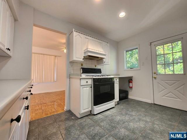 26 7th Street, Unit B Cresskill, NJ 07626 - Photo 10 of 26 a kitchen with granite countertop a stove and a refrigerator