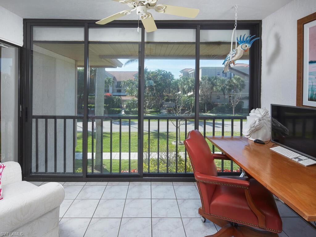 415 10th Avenue South, Unit 7 Naples, FL 34102 - Photo 12 of 15 a roof deck with table and chairs