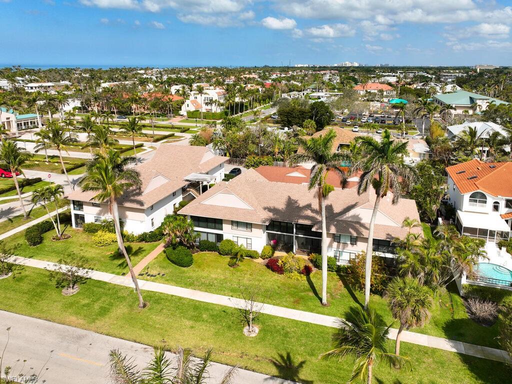 415 10th Avenue South, Unit 7 Naples, FL 34102 - Photo 15 of 15 an aerial view of residential houses with outdoor space and swimming pool