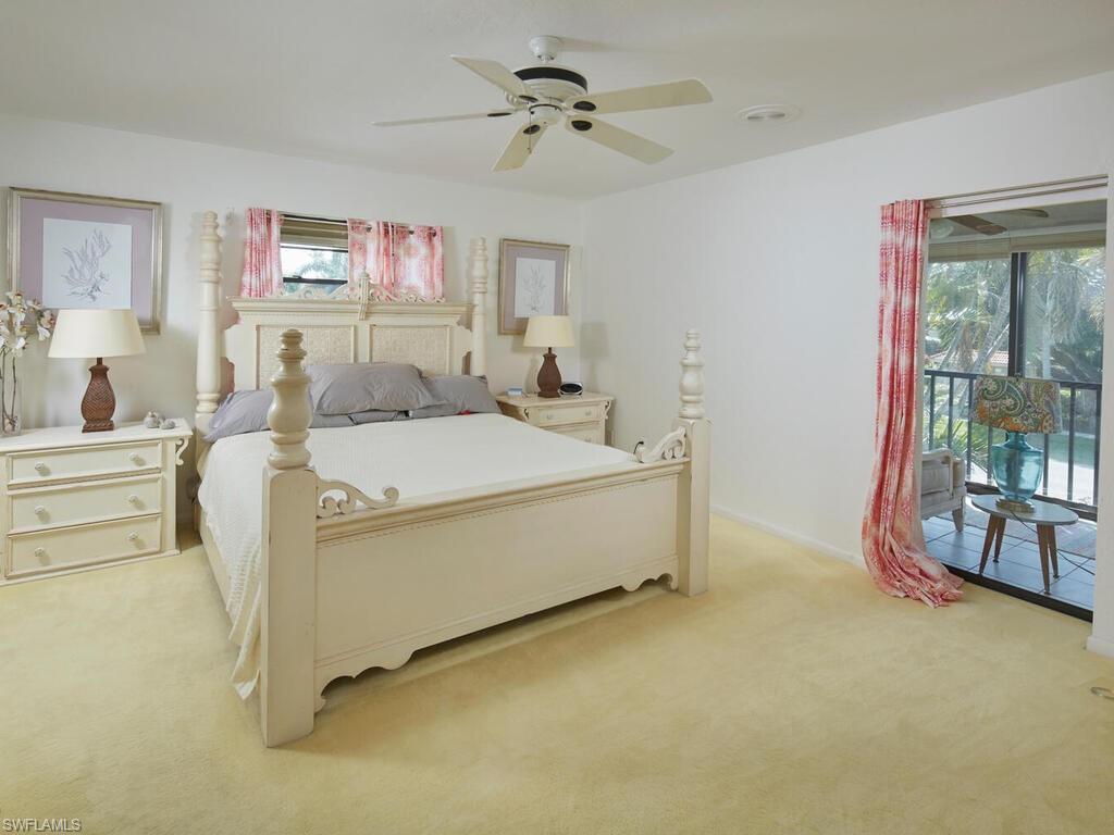 415 10th Avenue South, Unit 7 Naples, FL 34102 - Photo 8 of 15 a living room with furniture and a ceiling fan