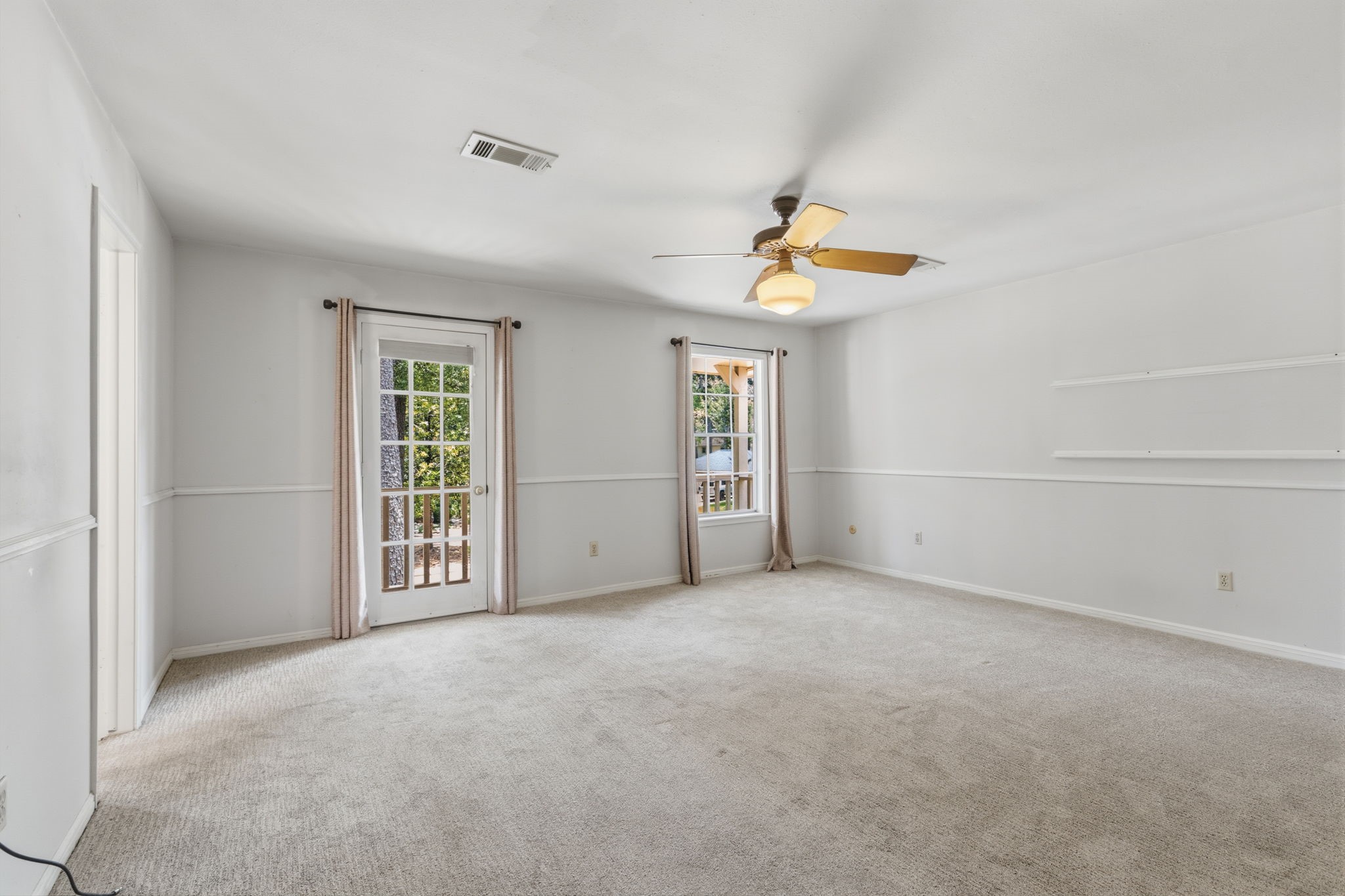 3422 Candlewisp Drive Spring, TX 77388 - Photo 23 of 50 PRIMARY BEDROOM - Spacious room with a doorway to the upstairs balcony.