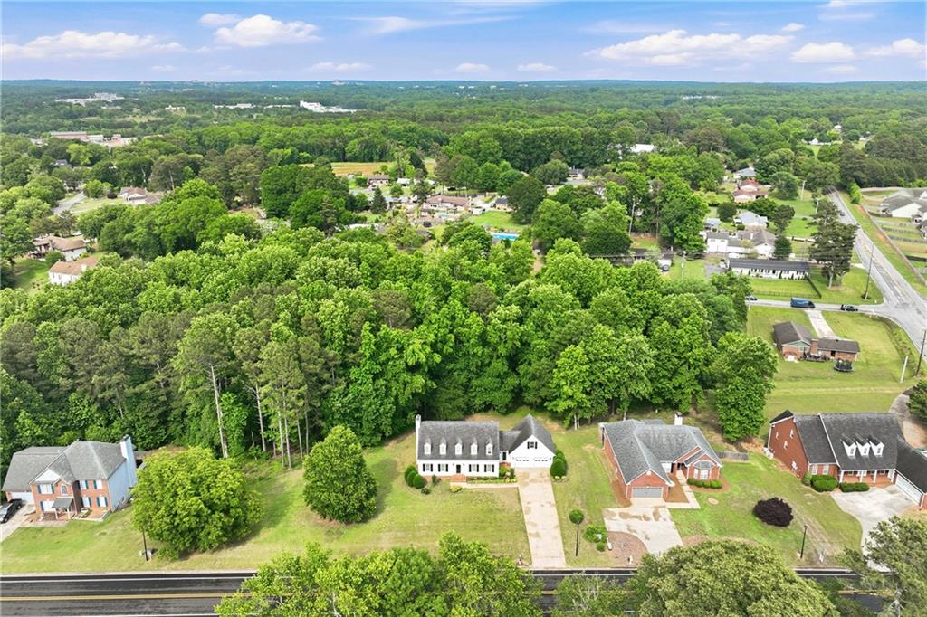 3608 Maple Forge Lane Gainesville, GA 30504 - Photo 39 of 45 a view of a city with lush green forest