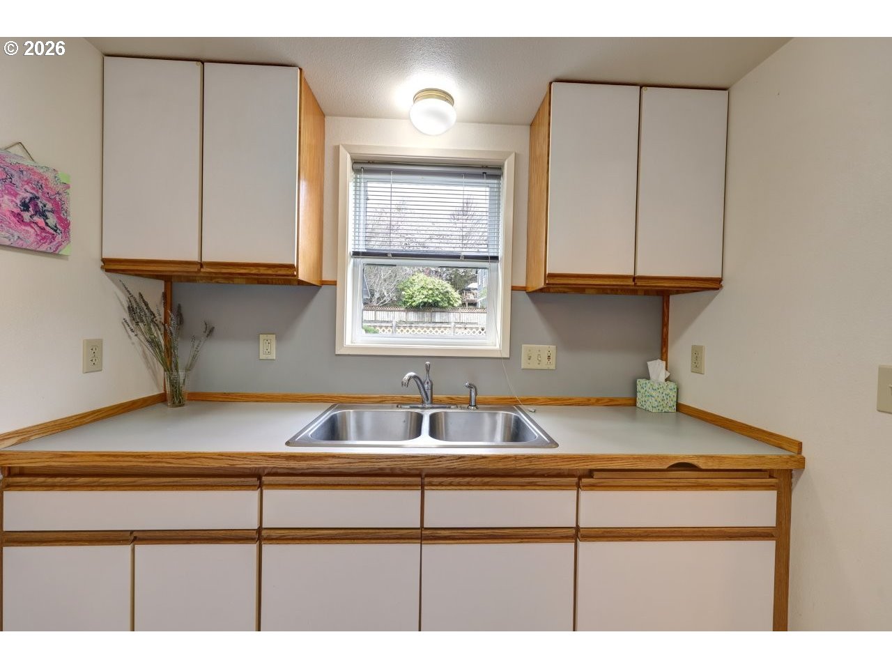 1449 9th Street Astoria, OR 97103 - Photo 11 of 20 a kitchen with a sink cabinets and a window