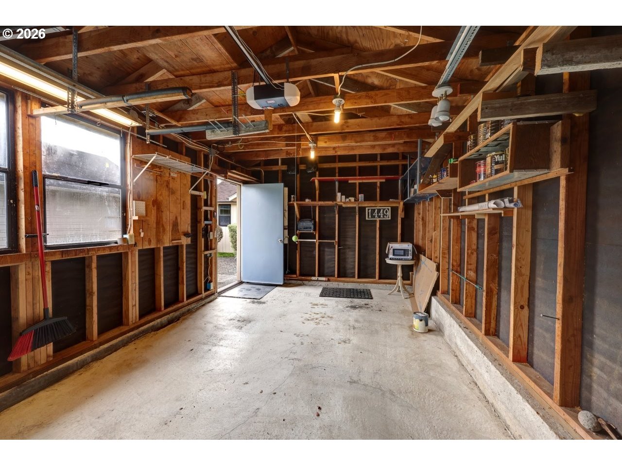 1449 9th Street Astoria, OR 97103 - Photo 16 of 20 a view of an empty room with wooden walls