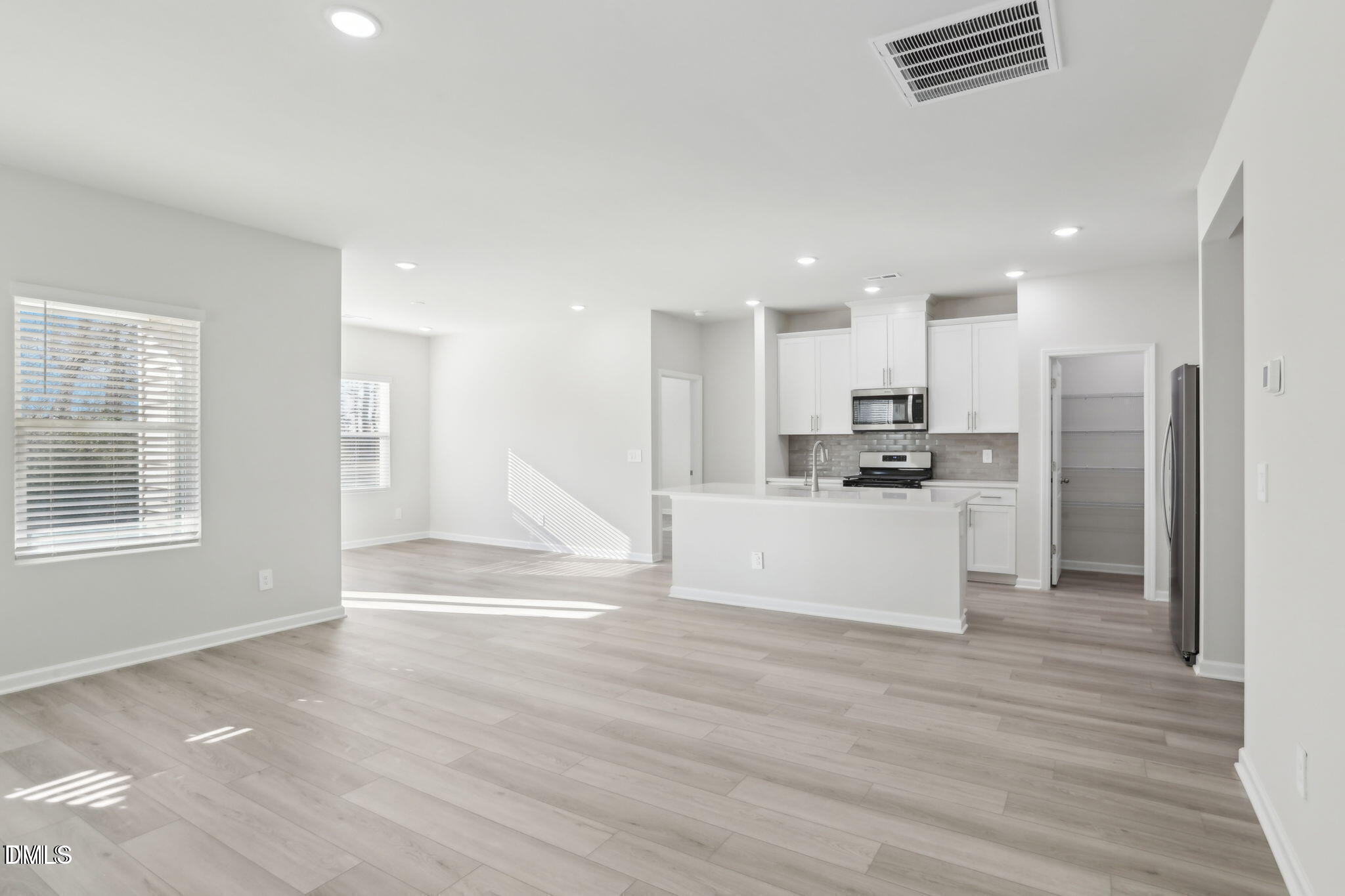 283 White Birch Lane Angier, NC 27501 - Photo 11 of 12 a view of kitchen with wooden floor and electronic appliances