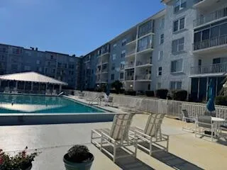 a view of pool with outdoor seating