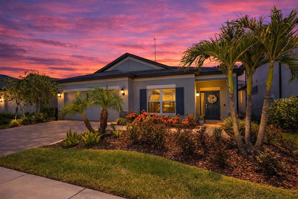 a front view of a house with garden