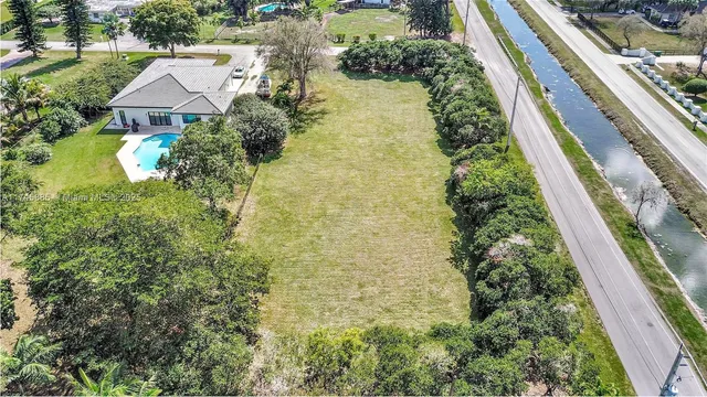 an aerial view of residential house with an outdoor space