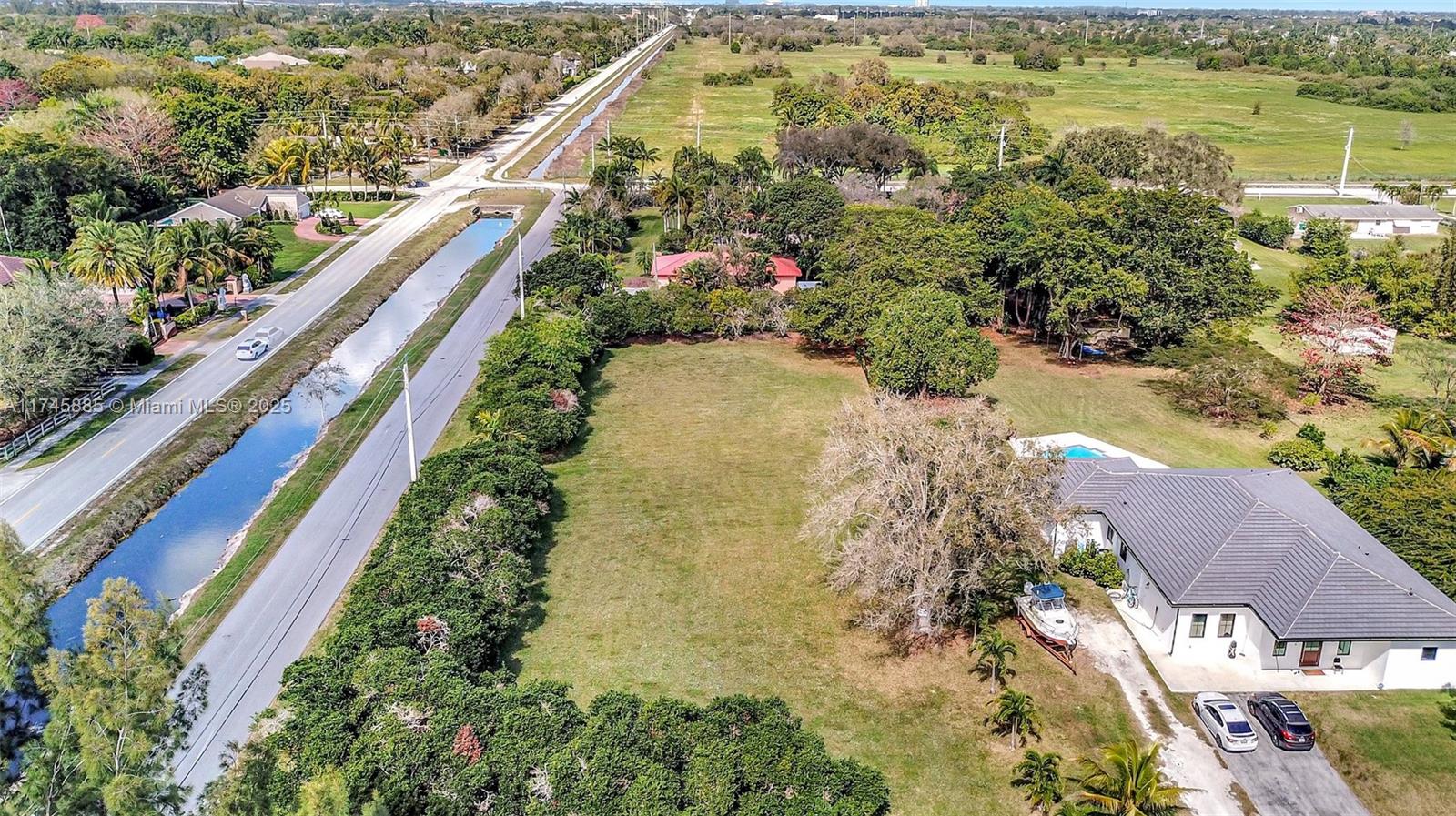28 Sw Street Davie, FL 33330 - Photo 4 of 11 a view of a lake with a flower garden