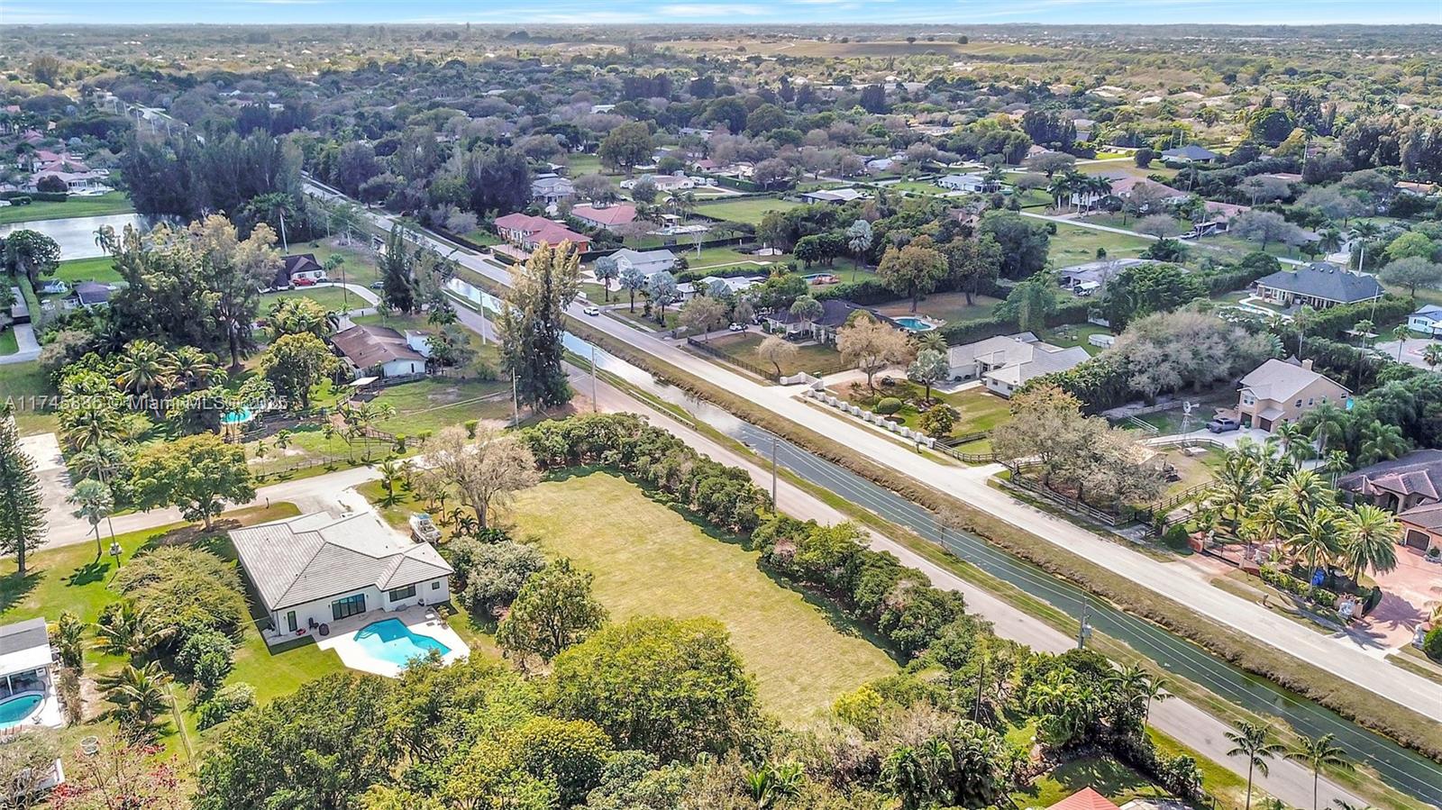 28 Sw Street Davie, FL 33330 - Photo 8 of 11 an aerial view of residential houses with outdoor space