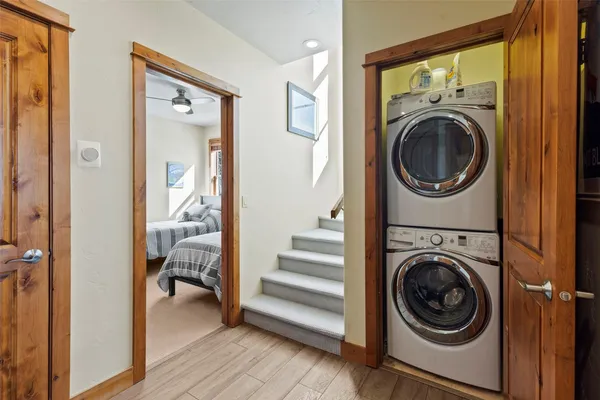 a view of a hallway with washer and dryer