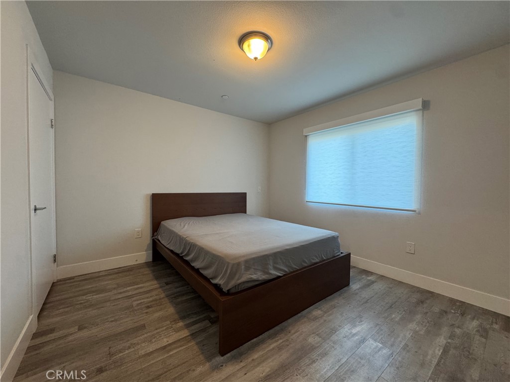 7958 Telegraph Road Downey, CA 90240 - Photo 23 of 38 a bedroom with a bed and window