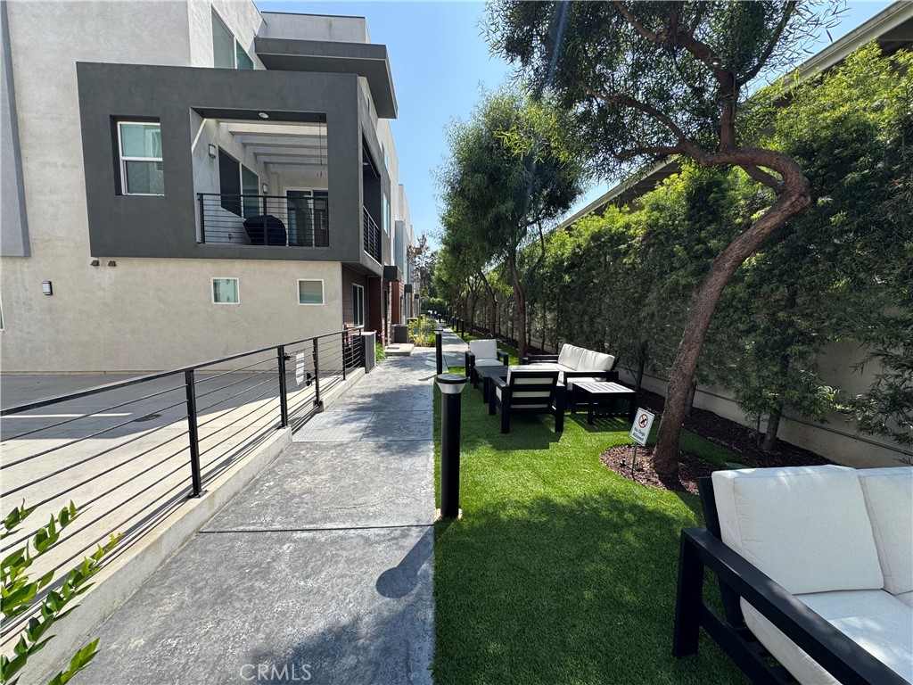 7958 Telegraph Road Downey, CA 90240 - Photo 33 of 38 a view of a house with backyard sitting area and garden