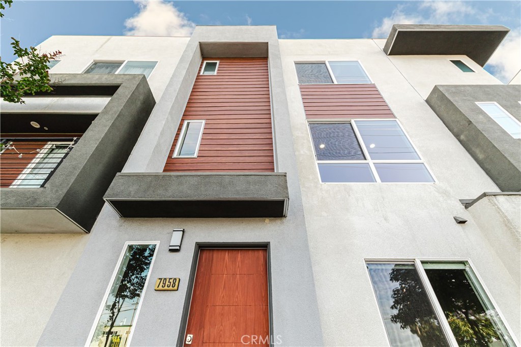 7958 Telegraph Road Downey, CA 90240 - Photo 38 of 38 a balcony with furniture and wooden floor